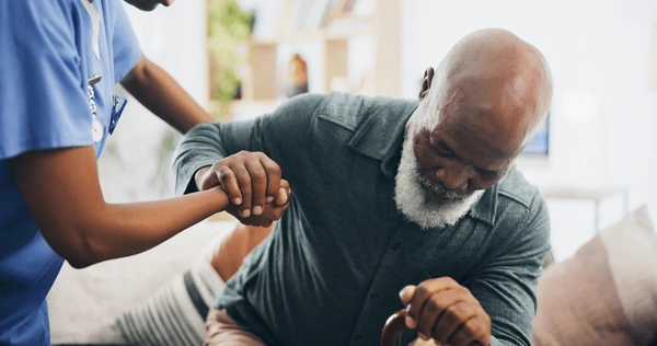 nurse senior man holding hands 600nw 2512972379